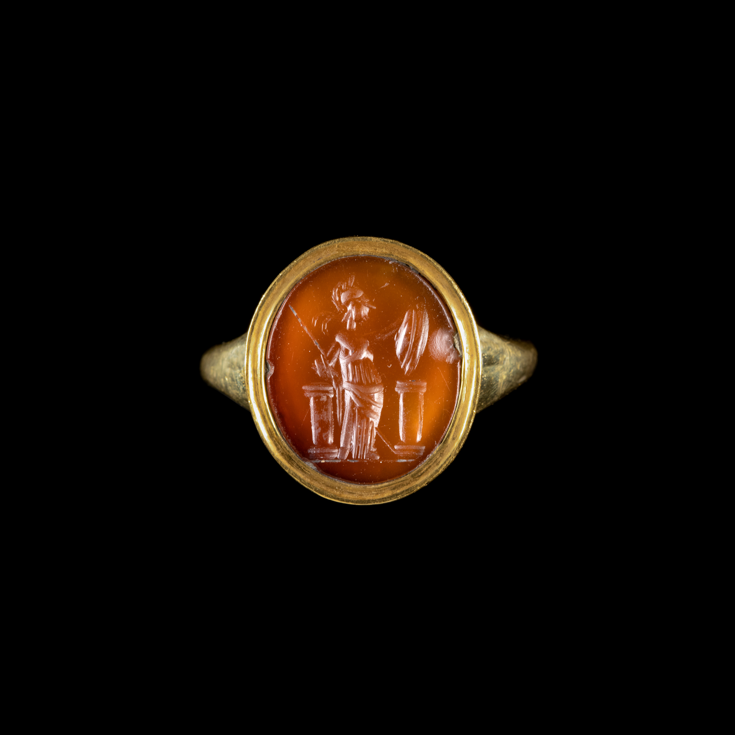 A modern gold ring set with a Roman carnelian intaglio. Athena. 